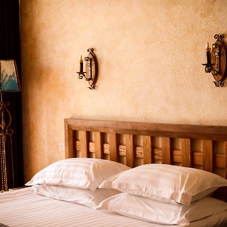 Caucasus Hotel Kasagh Exterior photo A bed with two pillows