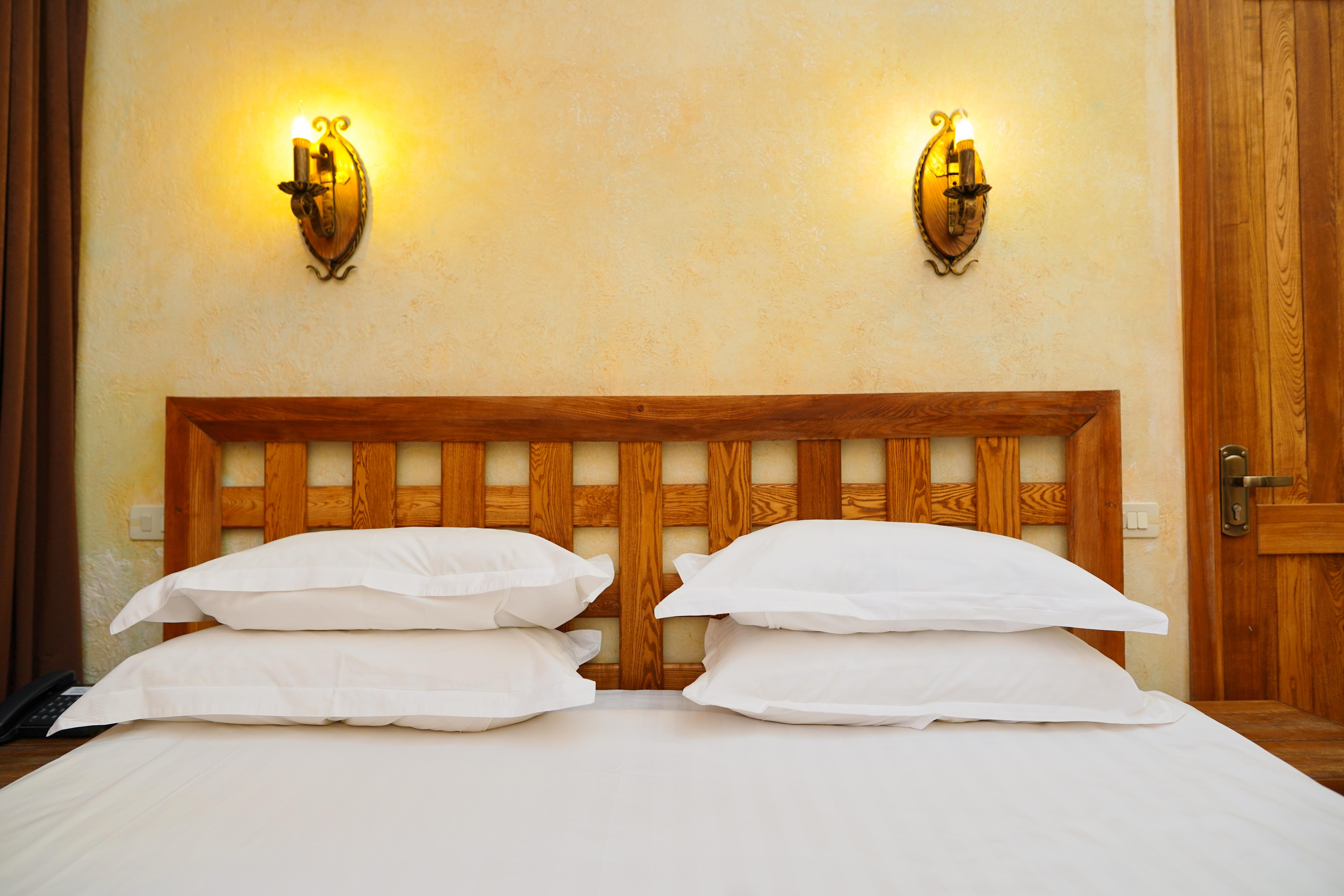 Caucasus Hotel Kasagh Exterior photo A bed with two pillows