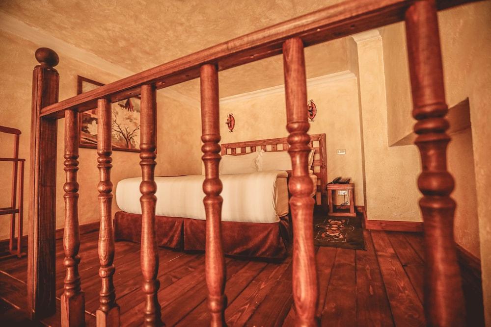 Caucasus Hotel Kasagh Exterior photo A bed in a hotel room